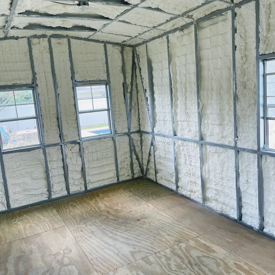 Closed-cell spray foam insulation applied to wall cavities in a residential project in Riverdale